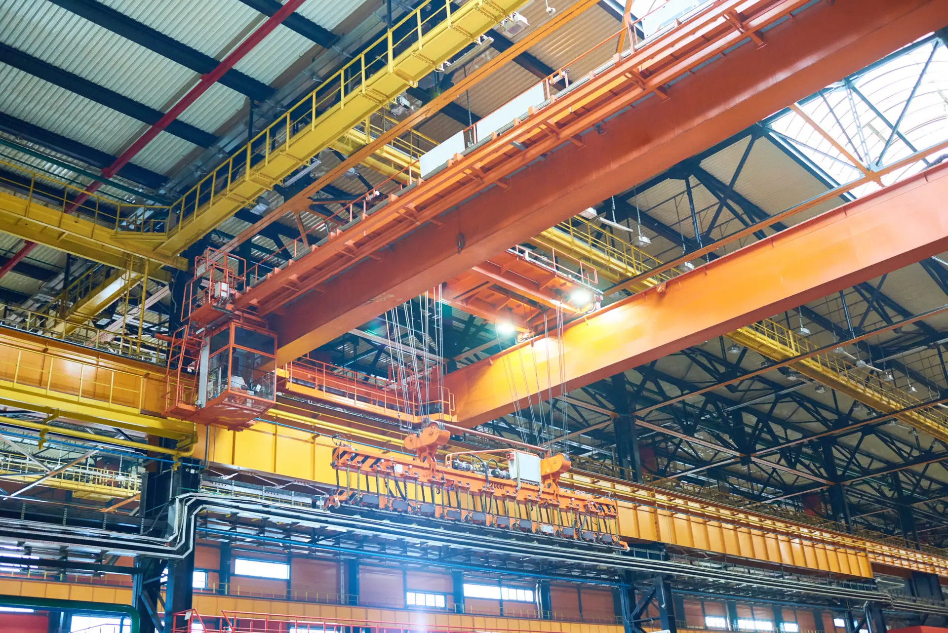 Modern factory design: reliable framed ceiling construction with powerful overhead crane