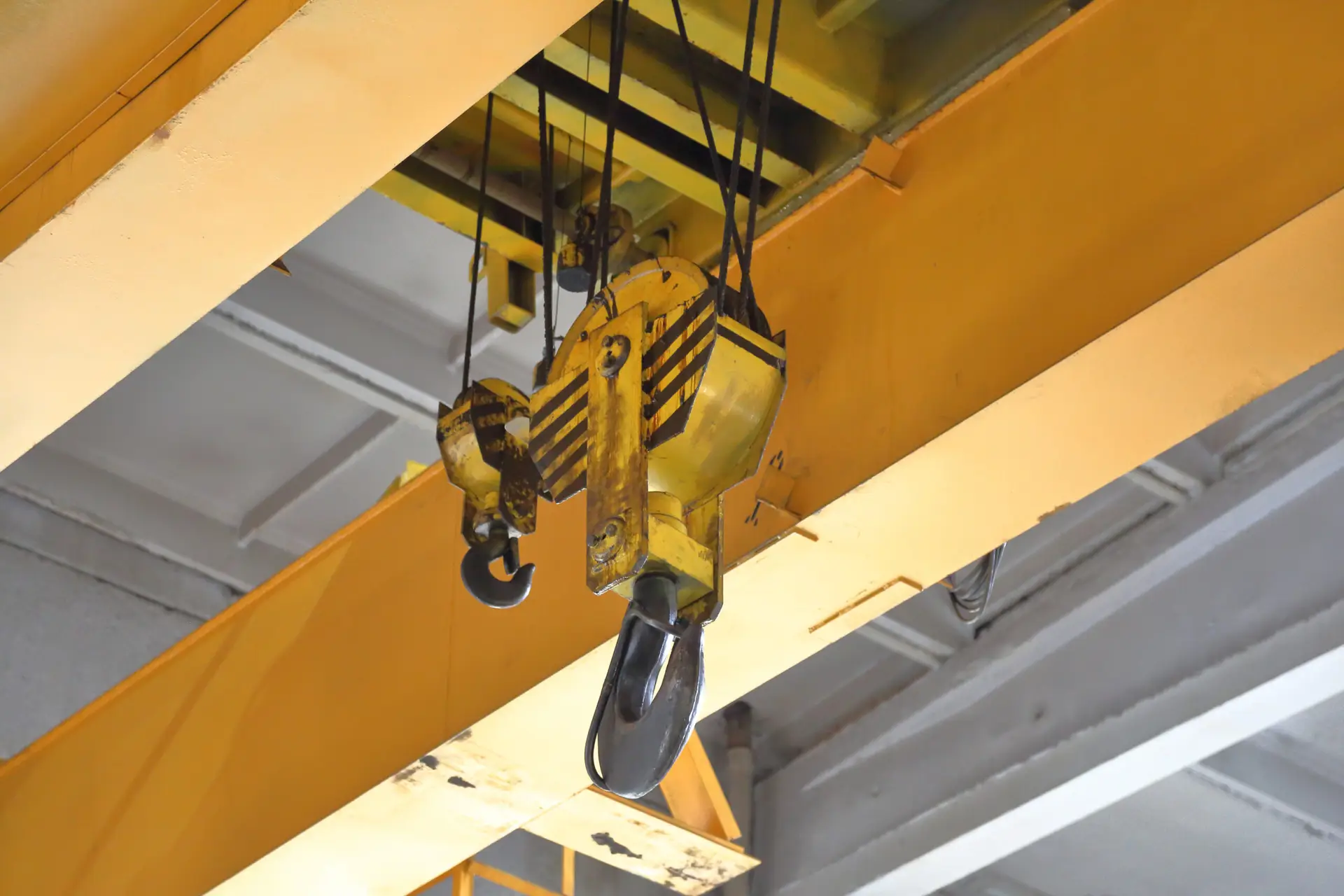 Big industrial iron hook for lifting and moving parts in the repair shop